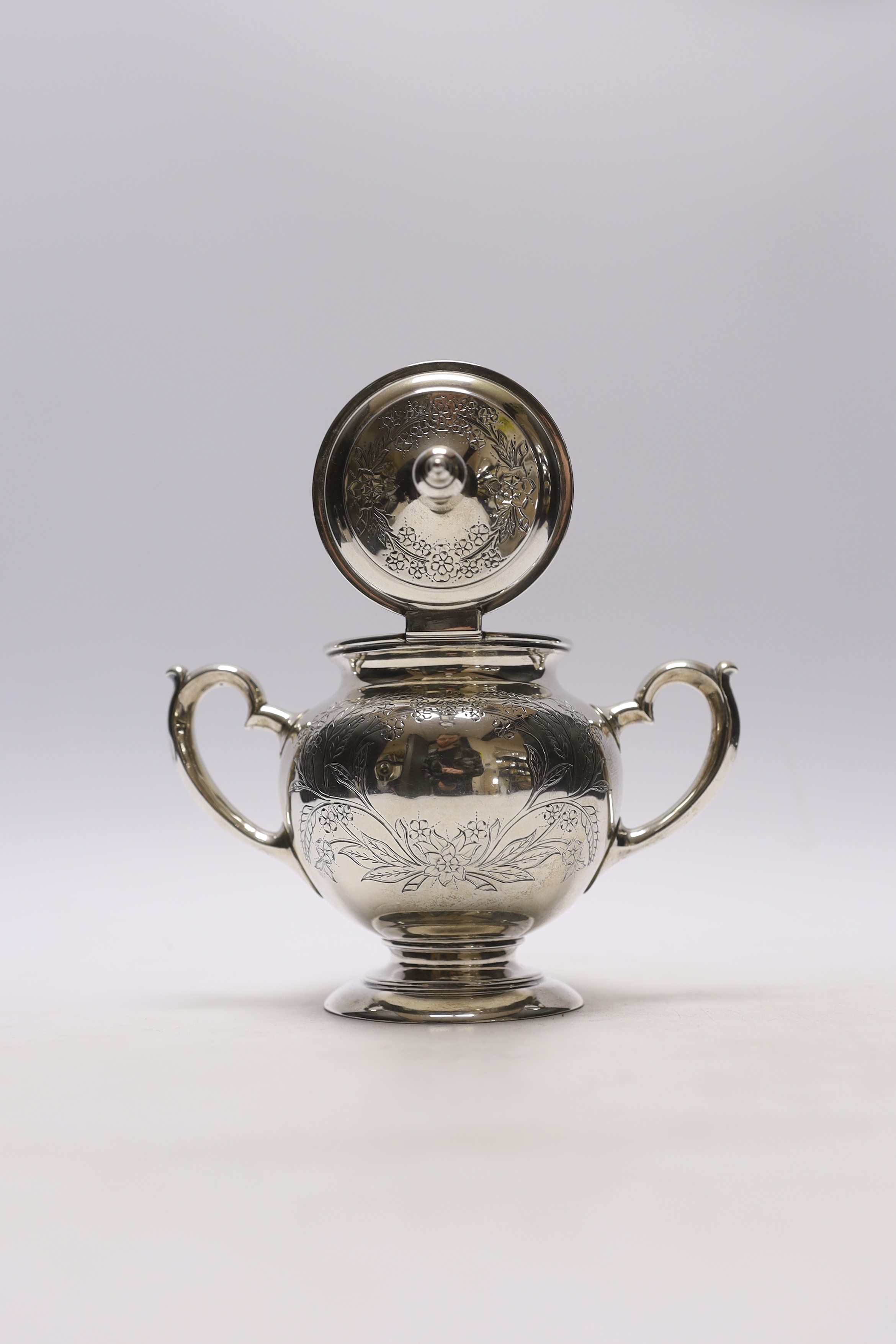 A late 19th century Russian 84 zolotnik two handled sugar bowl and hinged cover, unknown assay master, Moscow, 1883, height 18cm, 12.5oz.